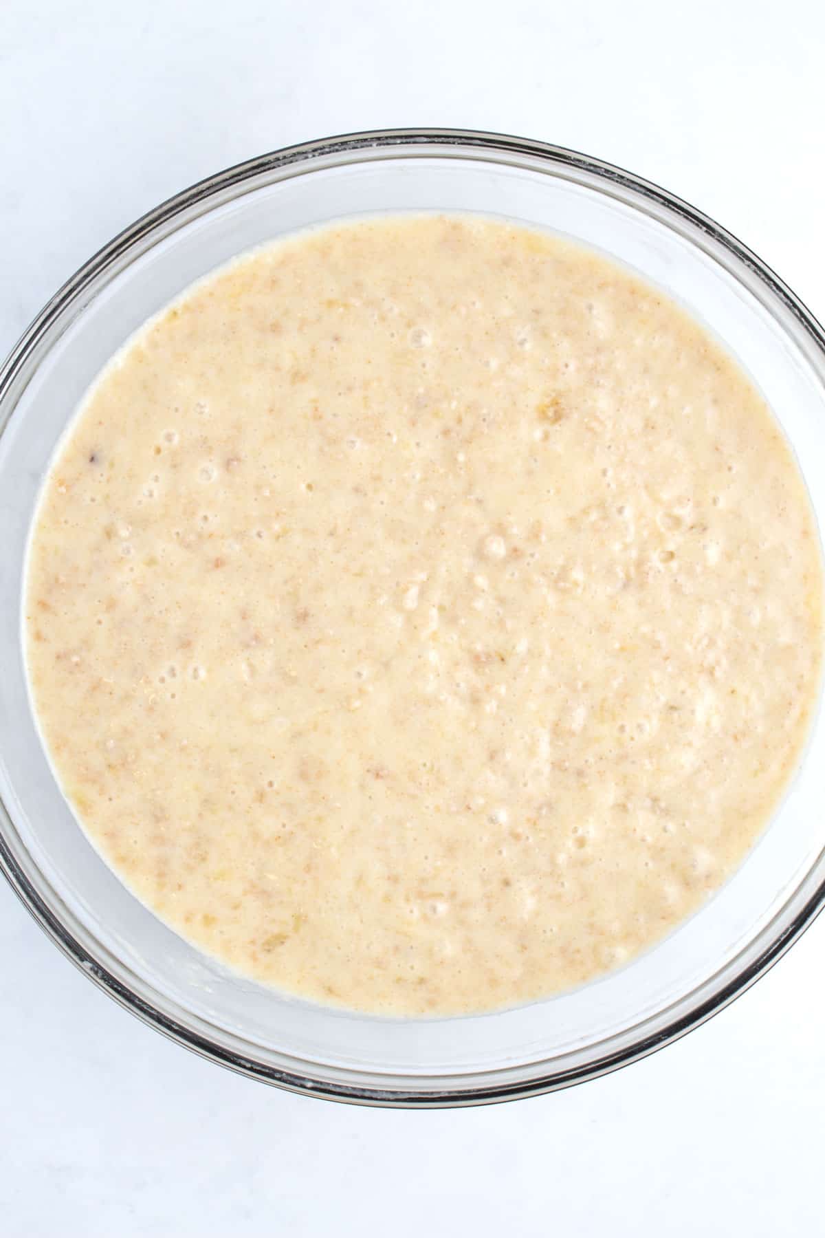A large mixing bowl full of batter.