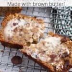 A slice of banana bread split in two on a cooling rack with brown text overlaid.