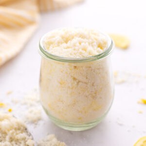 Closeup of lemon sugar packed into a jar.