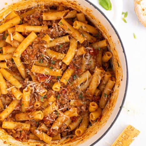 A large dutch oven full of ground beef pasta.