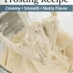 Cream cheese frosting caked on a mixing paddle over a bowl of more frosting with a graphic overlay.