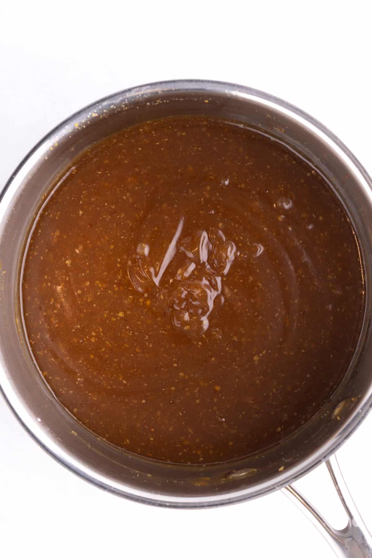 A saucepan of completed ham glaze.