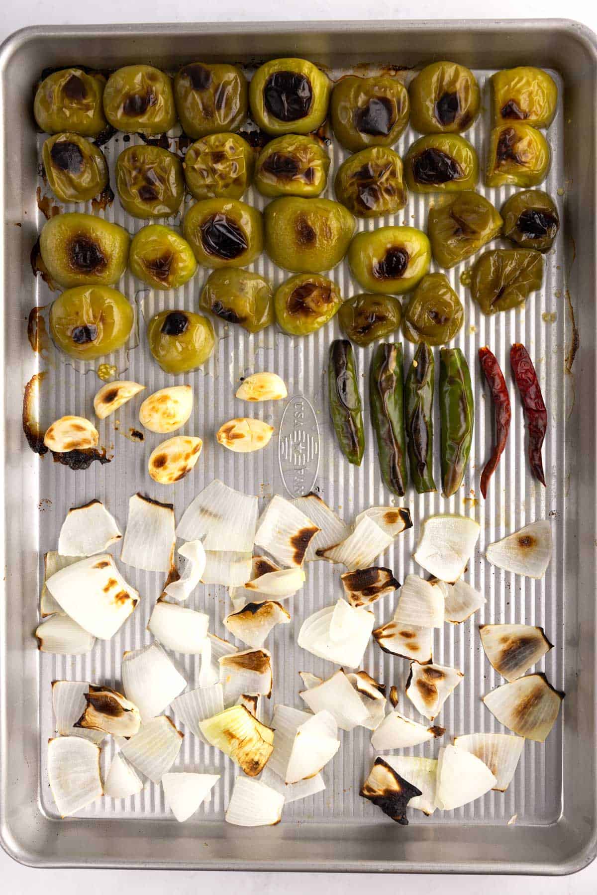 Roasted vegetables on a cooking sheet.