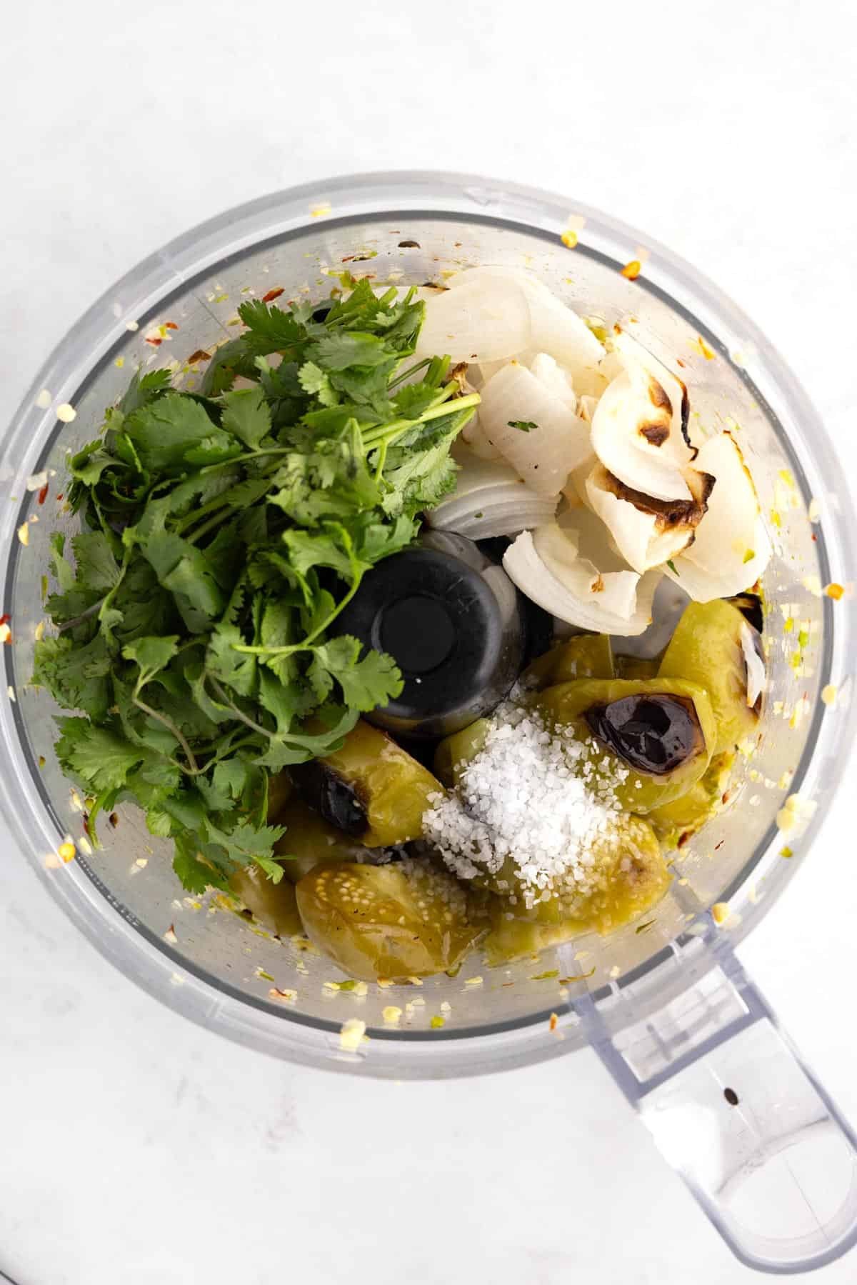 Salsa ingredients in a food processor.