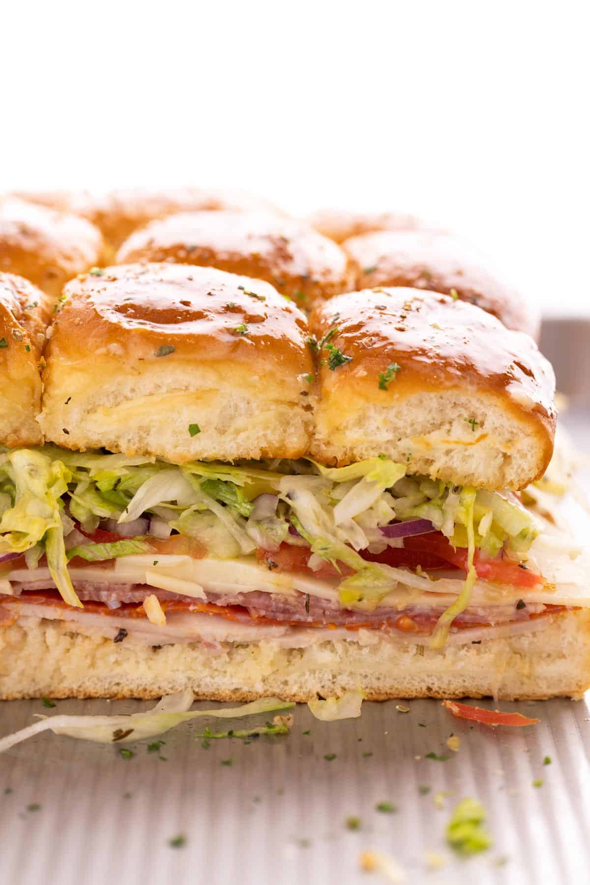 Closeup of a row of italian sliders.