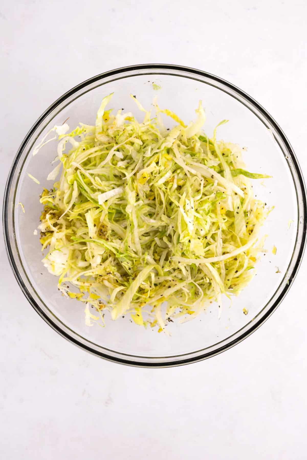 Lettuce mix in a glass bowl.