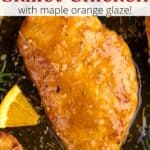 Closeup of an orange rosemary chicken breast with a graphic overlay.