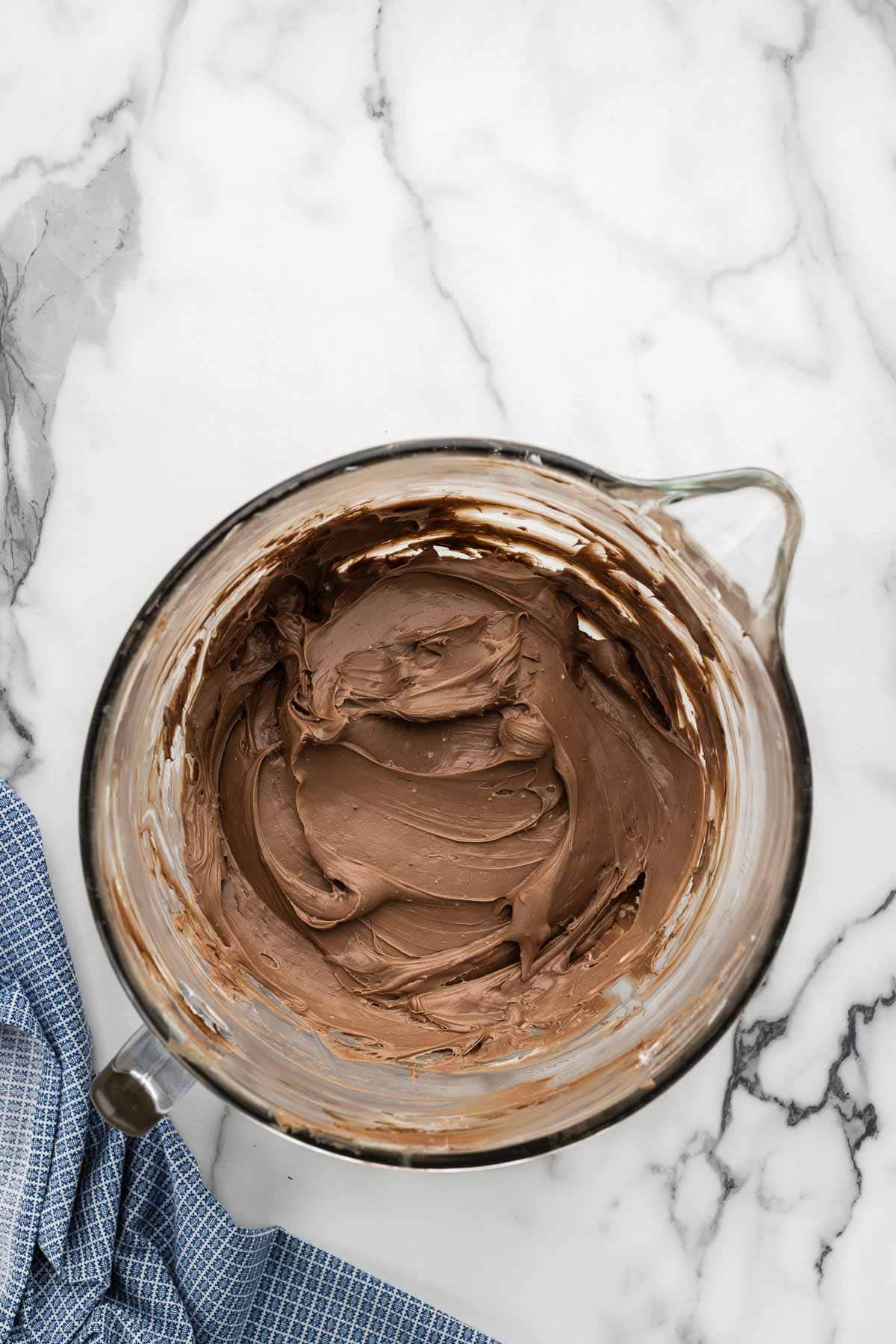 Chocolate batter in a large glass measuring bowl.