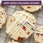 Closeup of a shortbread cookie on a cooling rack with an overlay of text.