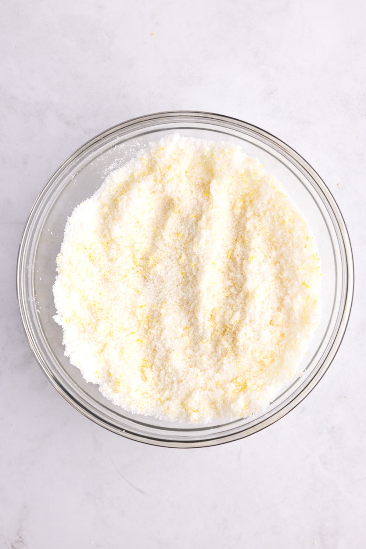 Lemon sugar mixture in a mixing dish.
