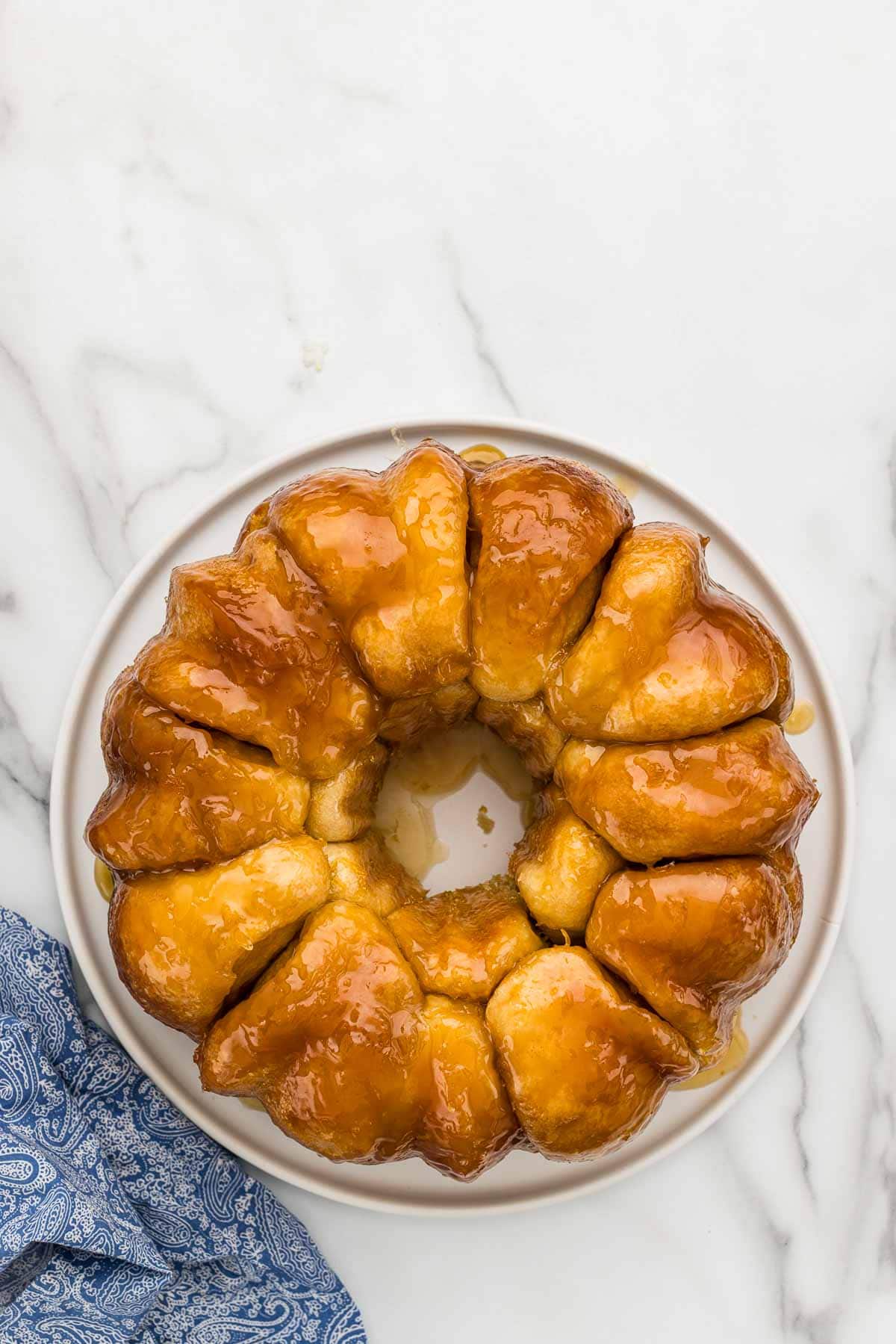 Plain lemon monkey bread upright on a cake platter.