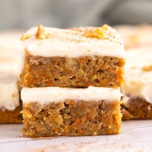 Closeup of a stack of carrot cake bars.