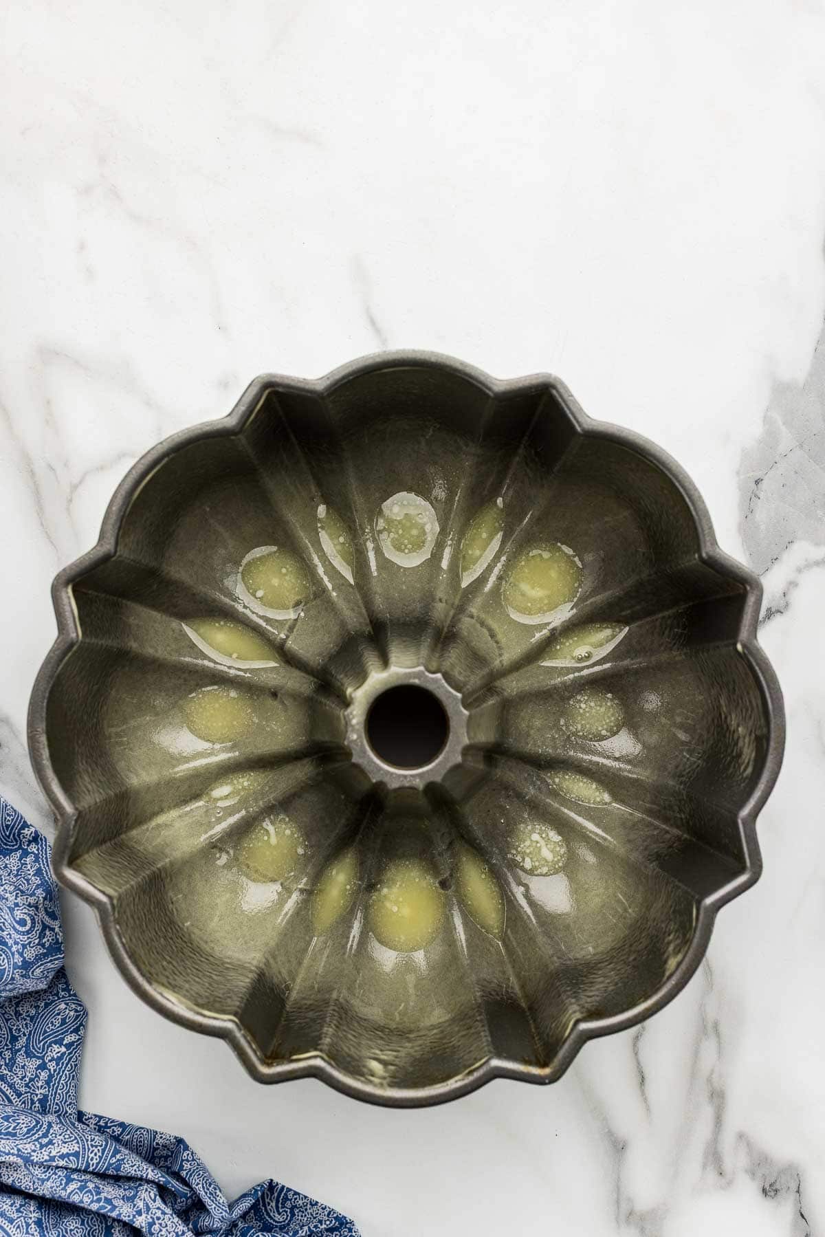 Butter at the bottom of a bundt pan.