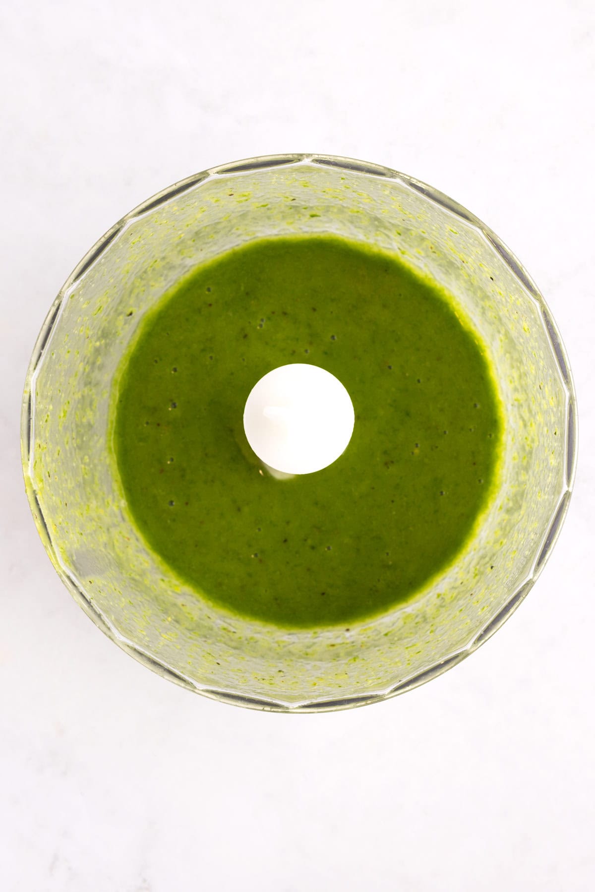 Blended salad dressing in a food processor.