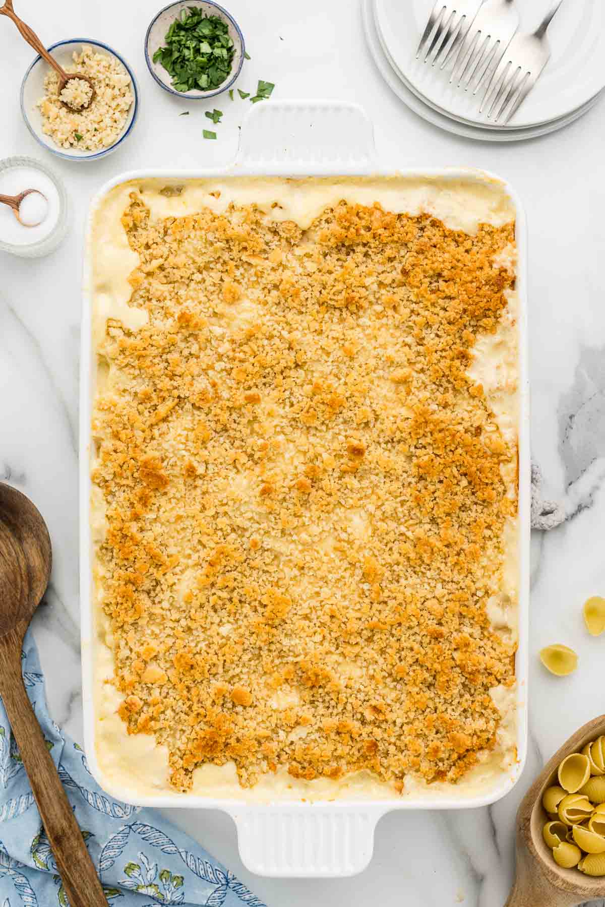 A pan of baked mac & cheese topped with breadcrumbs.