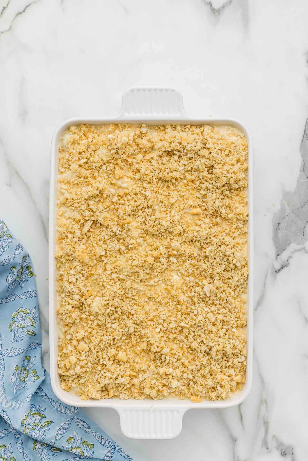 Mac and cheese in a baking pan before going in the oven.