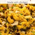 A spoonful of pineapple fried rice with a graphic overlay.