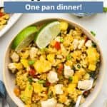 Pineapple fried rice in a serving dish with an overlay of text at the top of the image.