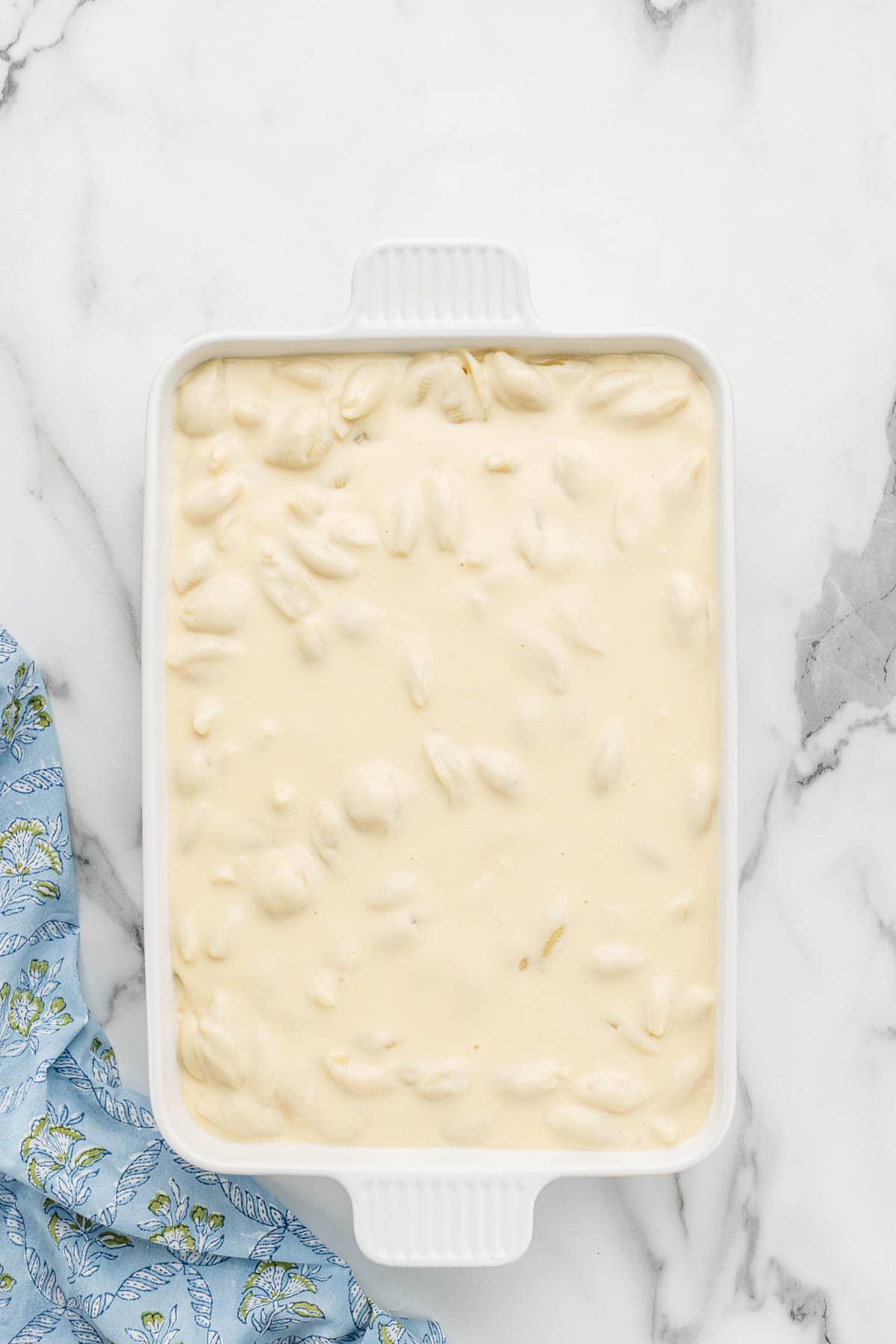 A large white baking pan of mac and cheese.