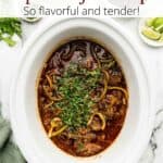 A crock pot of ropa vieja with a graphic overlay on the image.