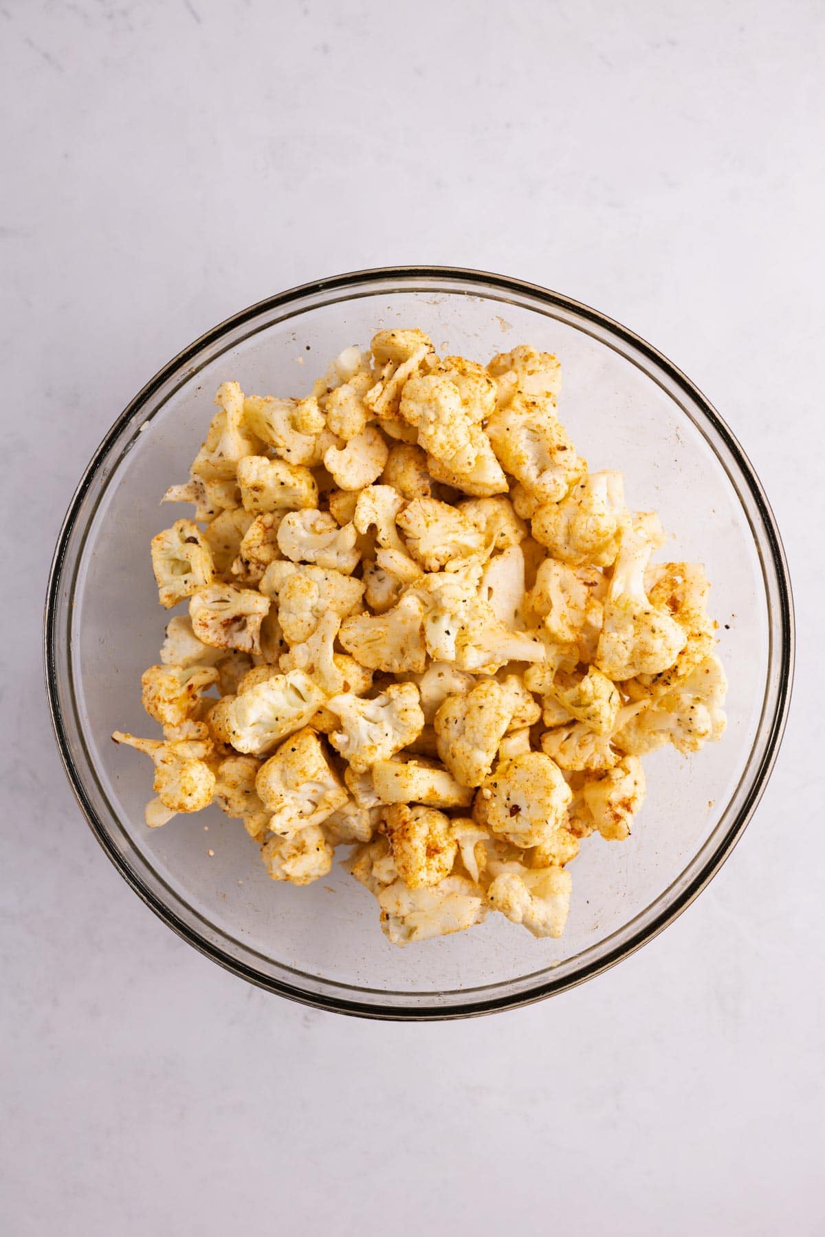 Seasoned cauliflower in a bowl.