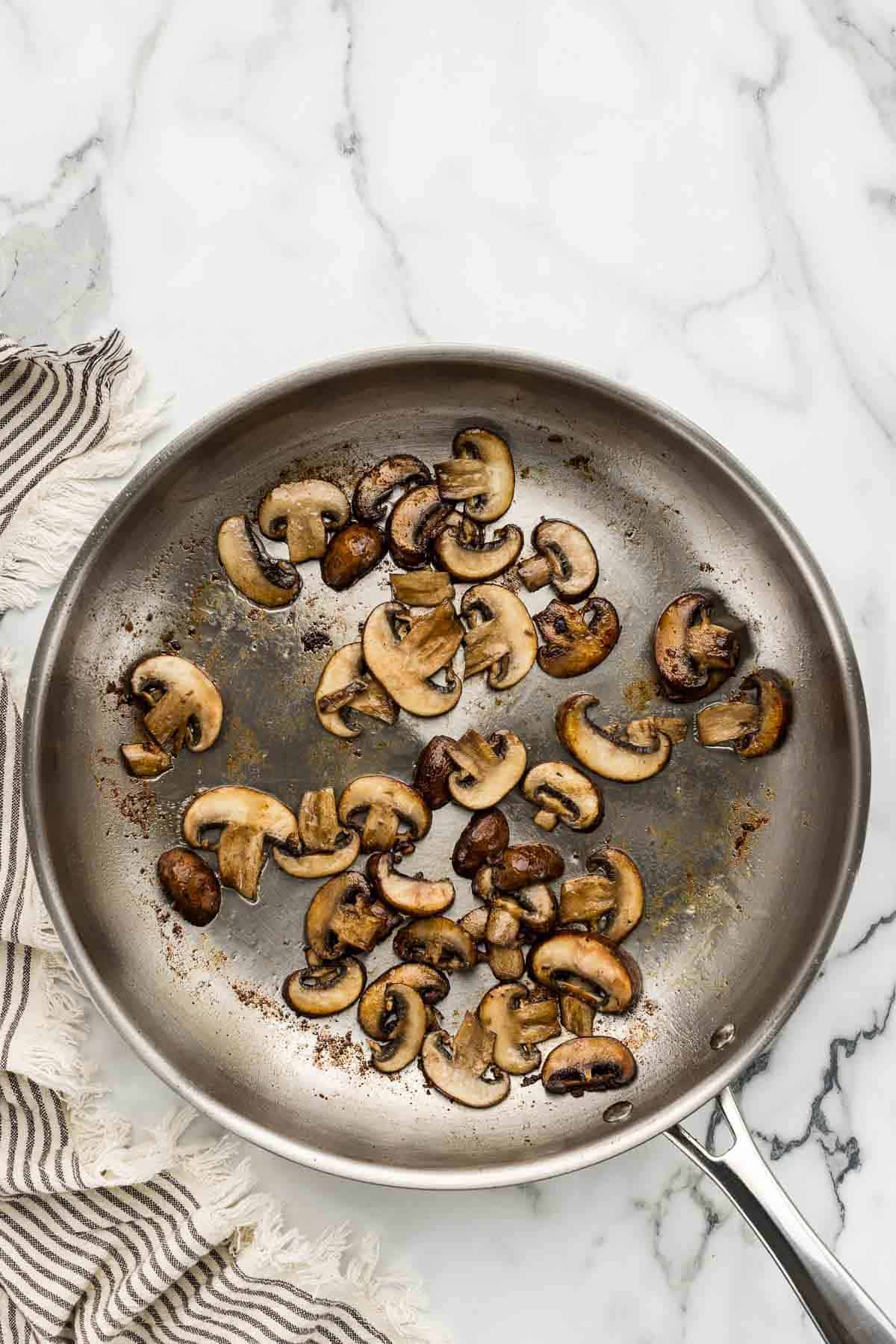 Mushrooms cooked in a skillet.