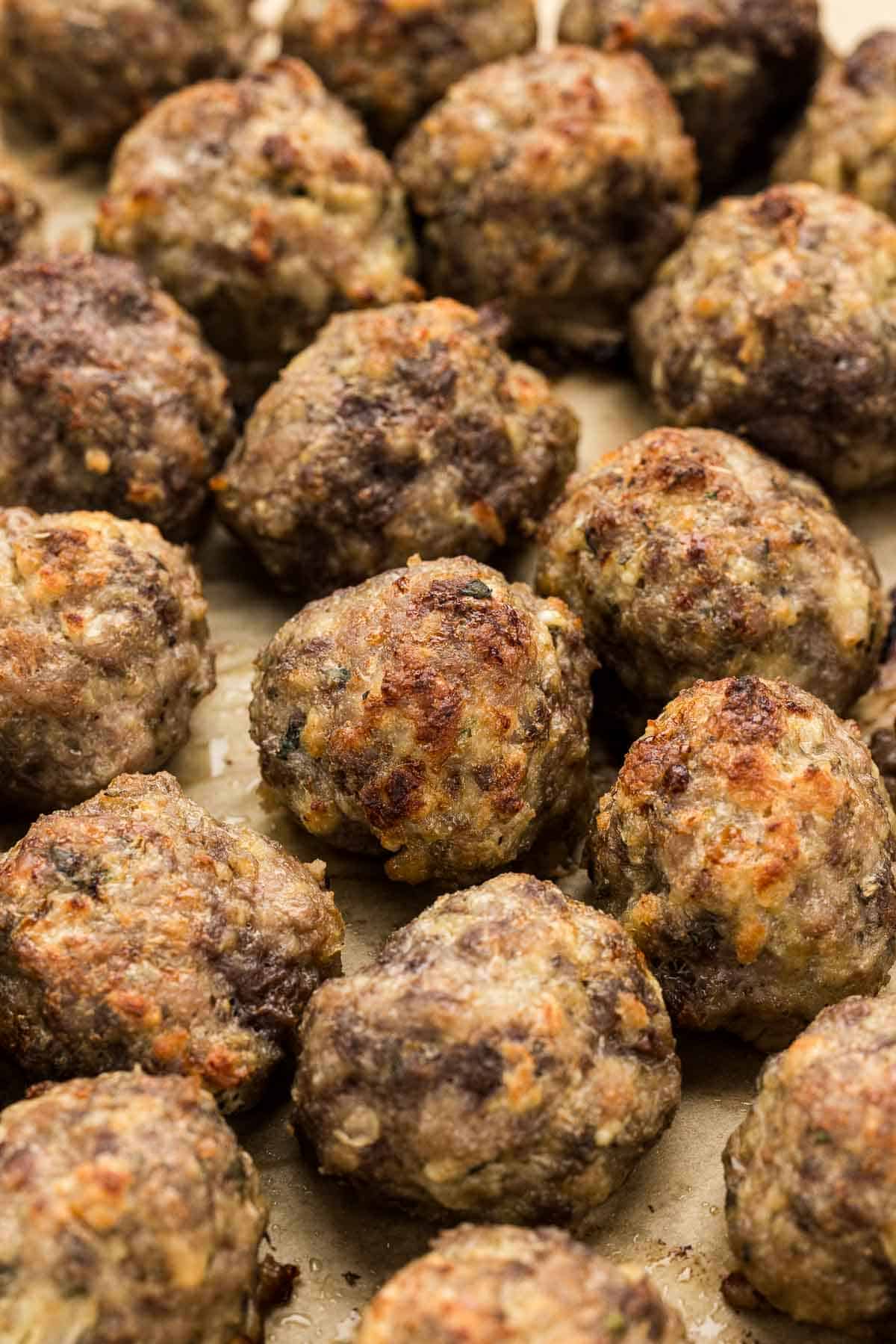 Baked meatballs on a pan.
