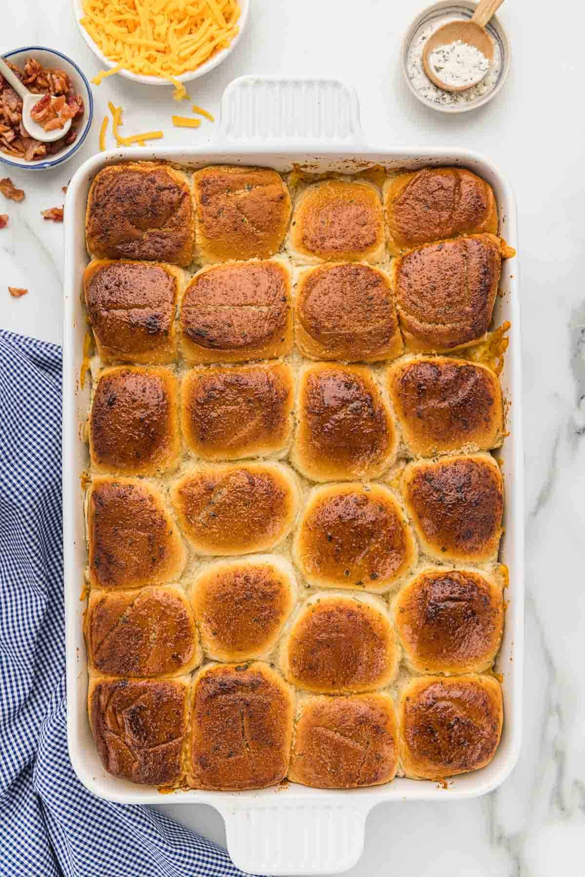 Baked sliders in a glass baking pan.