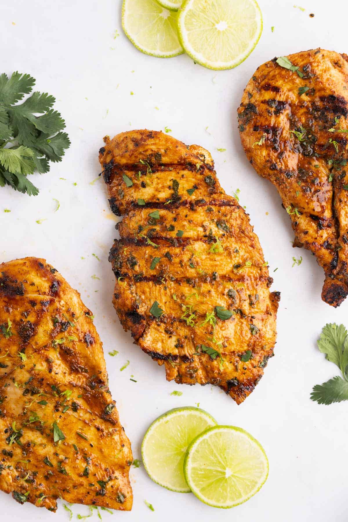 Chili lime chicken breasts lined up in a diagonal row.