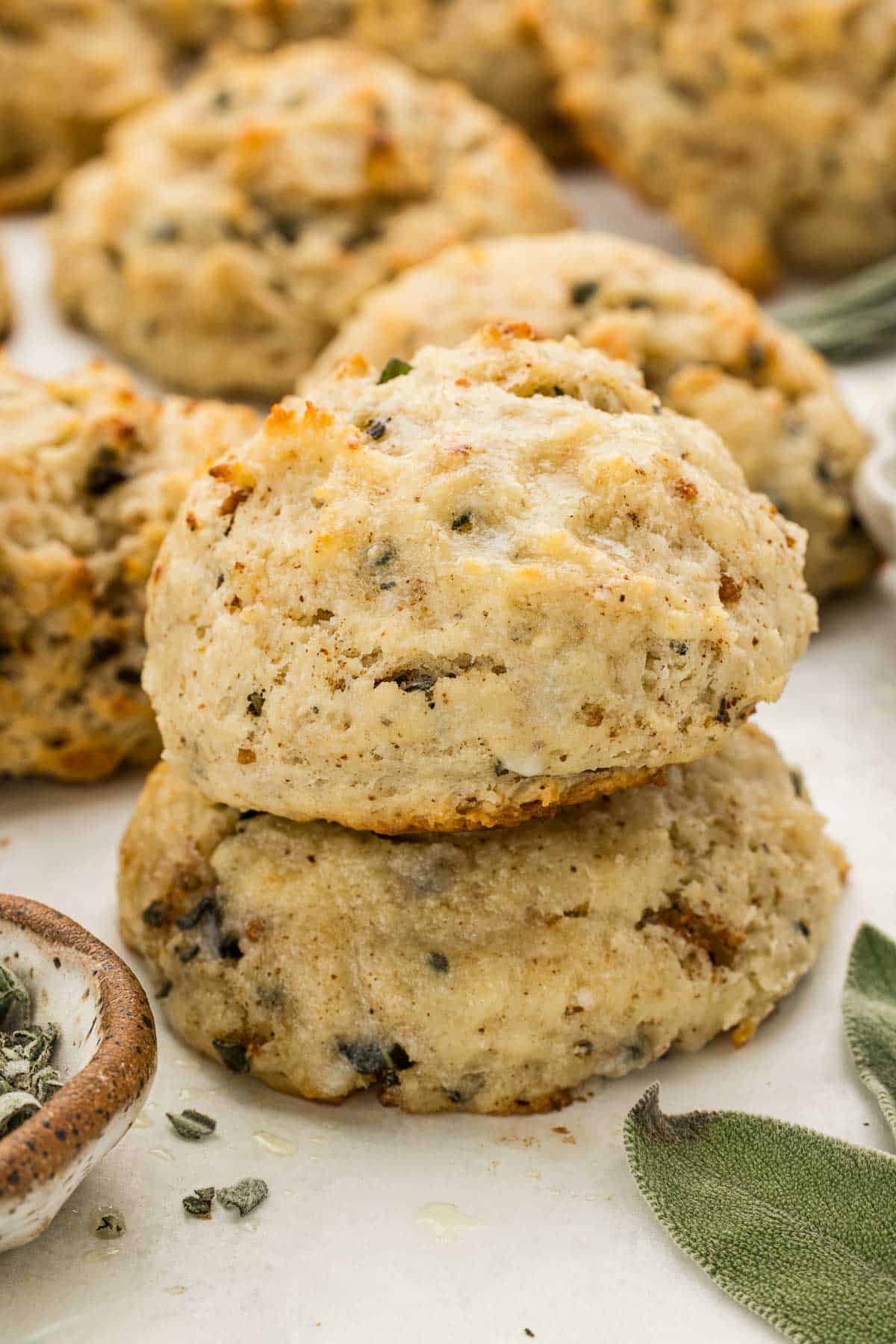 Two sage Biscuits stacked on top of each other.