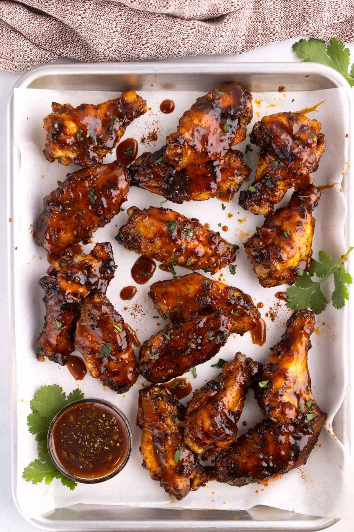 A sheet pan of honey chipotle chicken wings.