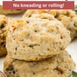 An overlay of text on an image of two biscuits stacked.