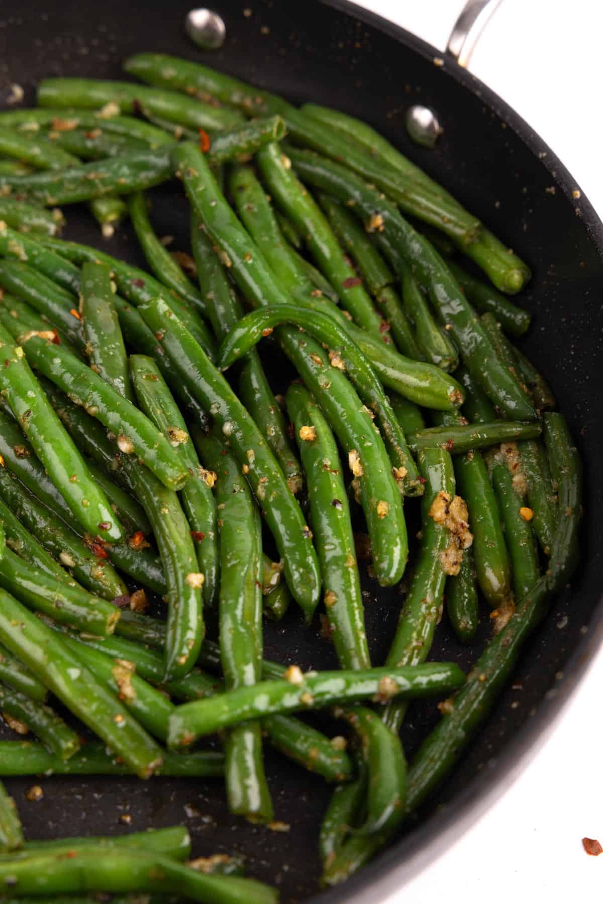 A skillet of garlic green beans.
